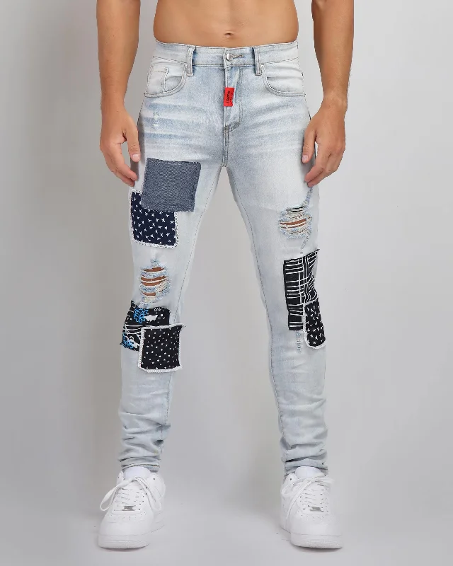 Cozy Essentials Blue Ripped Jeans with Striking Black Patches